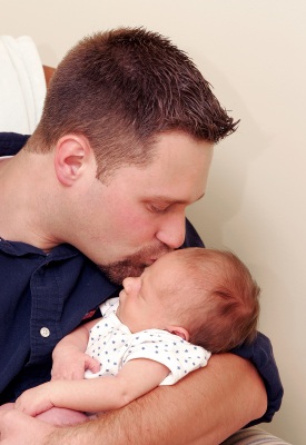 Dorset Fertility Home Page - man kissing baby